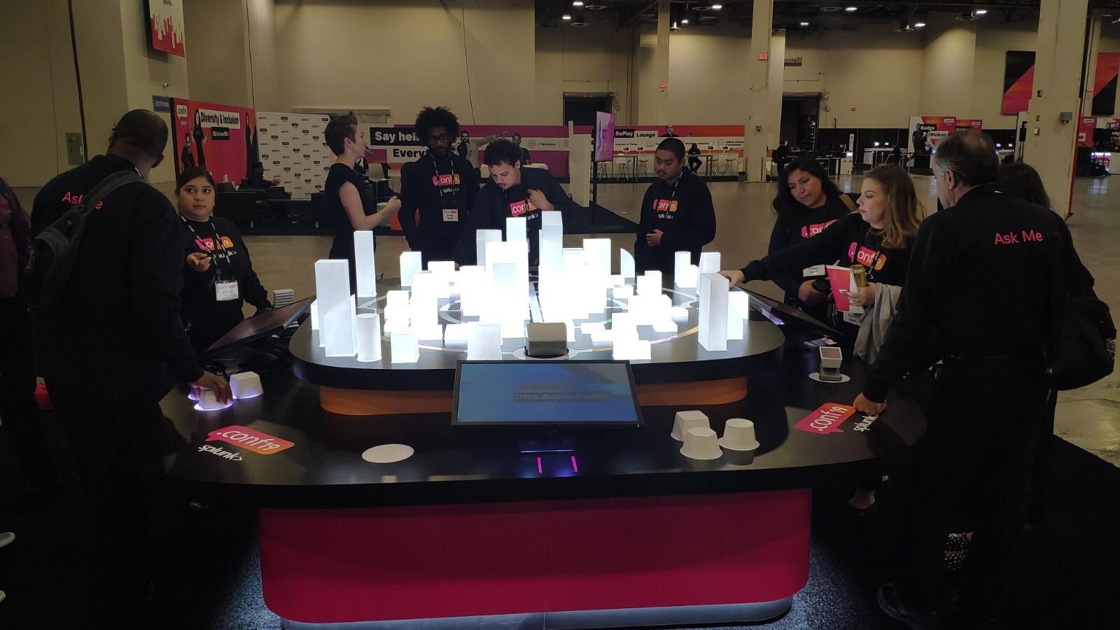 Attendees gathered around the lit Every Byte Counts smart-city model at Splunk .conf19