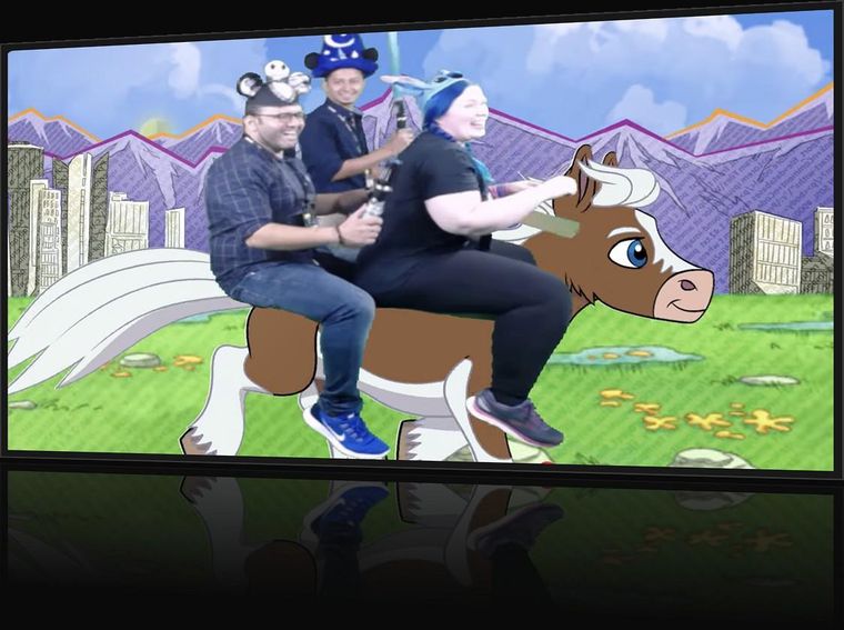 Walk-in loop — attendees riding Buttercup on the booth screen